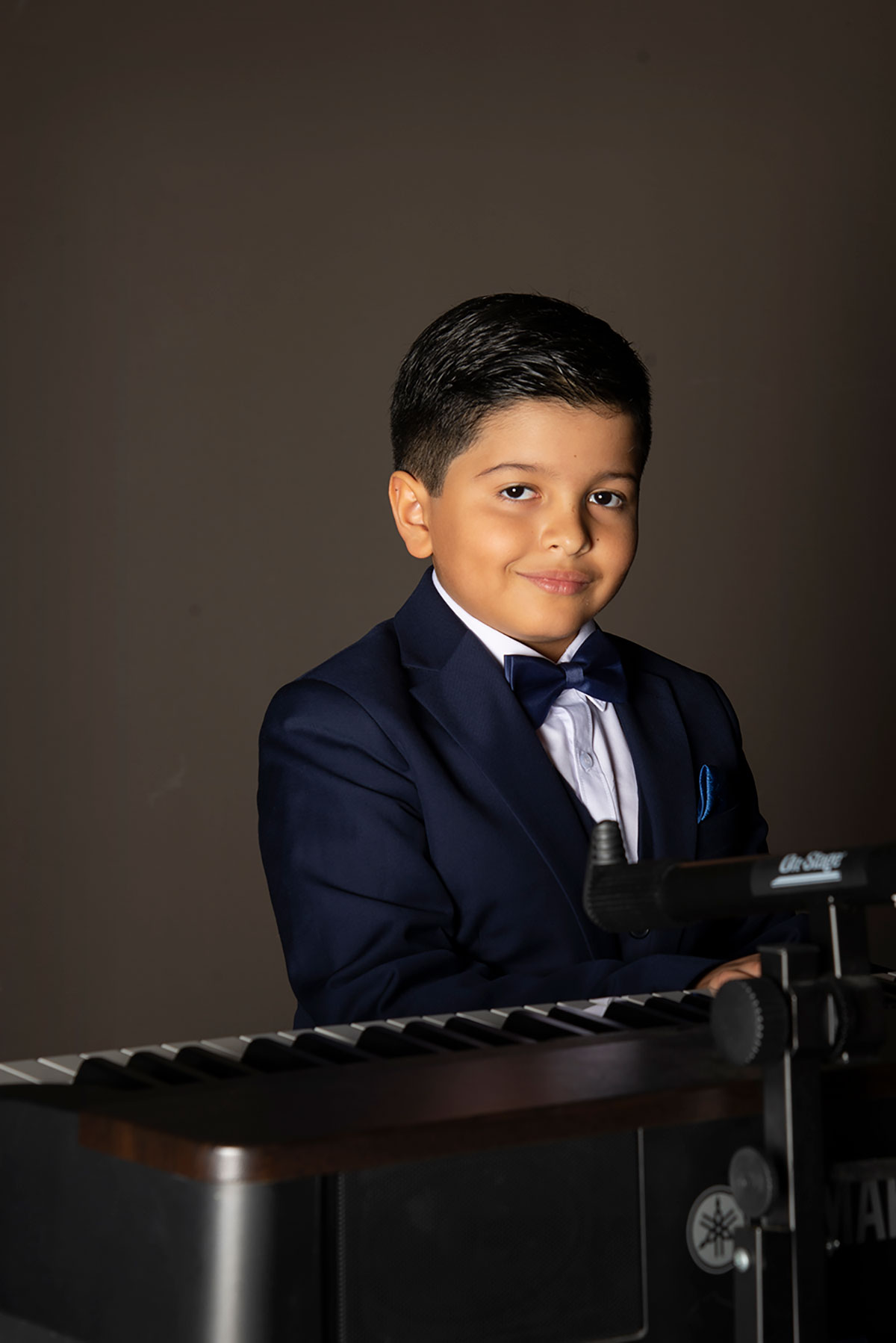 Angel David with his piano