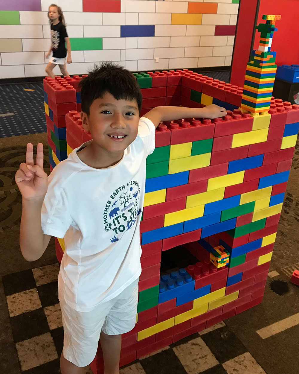 Robert's son with a Lego tower