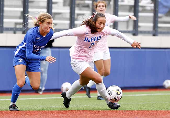 Kristin Boos takes the ball past an opponent.