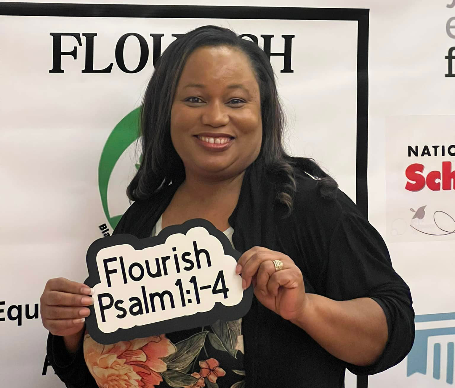 LaNissir James, HSLDA high school educational consultant and Black outreach coordinator, displays an inspirational sign.