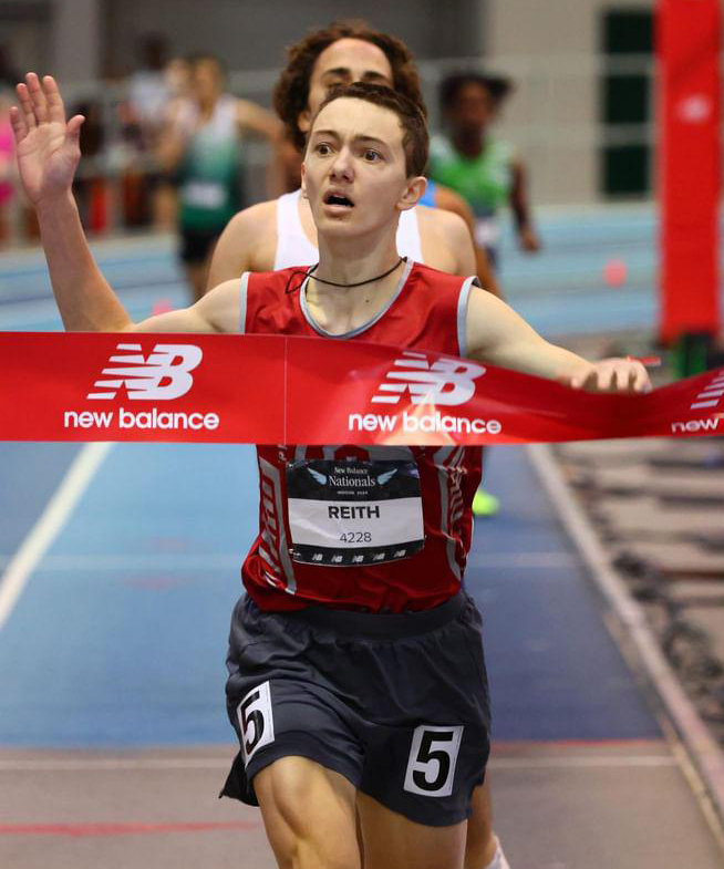 Sean crossing the finish line