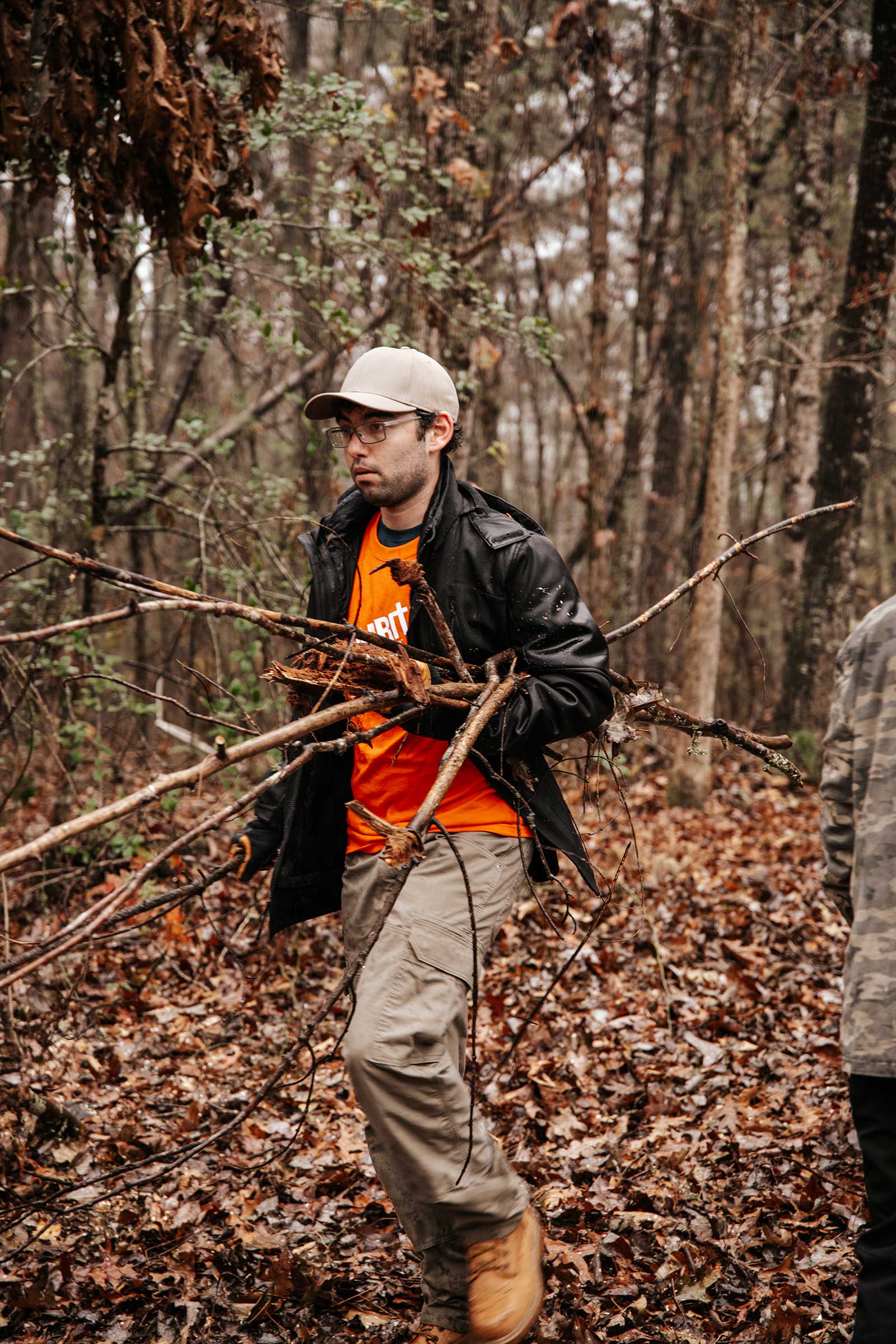Man clearing sticks