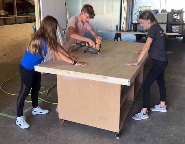 robotics team working in shop