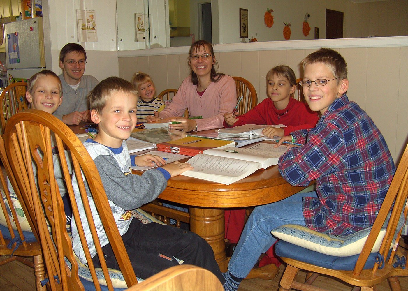 The Romeikes doing school at their dining table