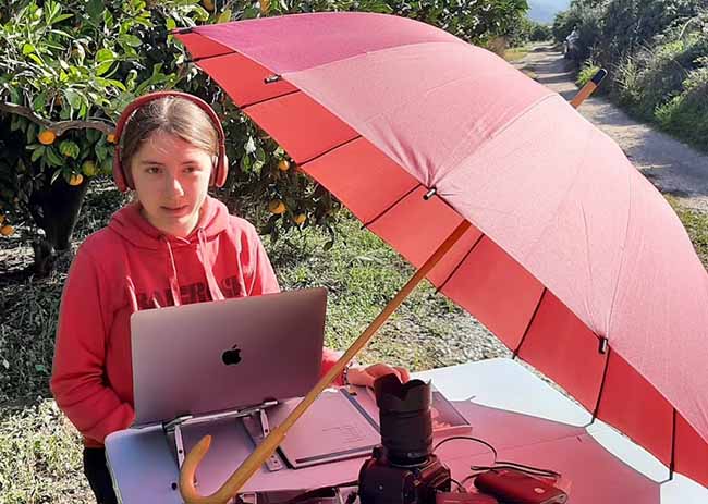 Nika studies outside during a field trip.