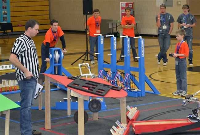 A young Evan takes part in a robotics competition.